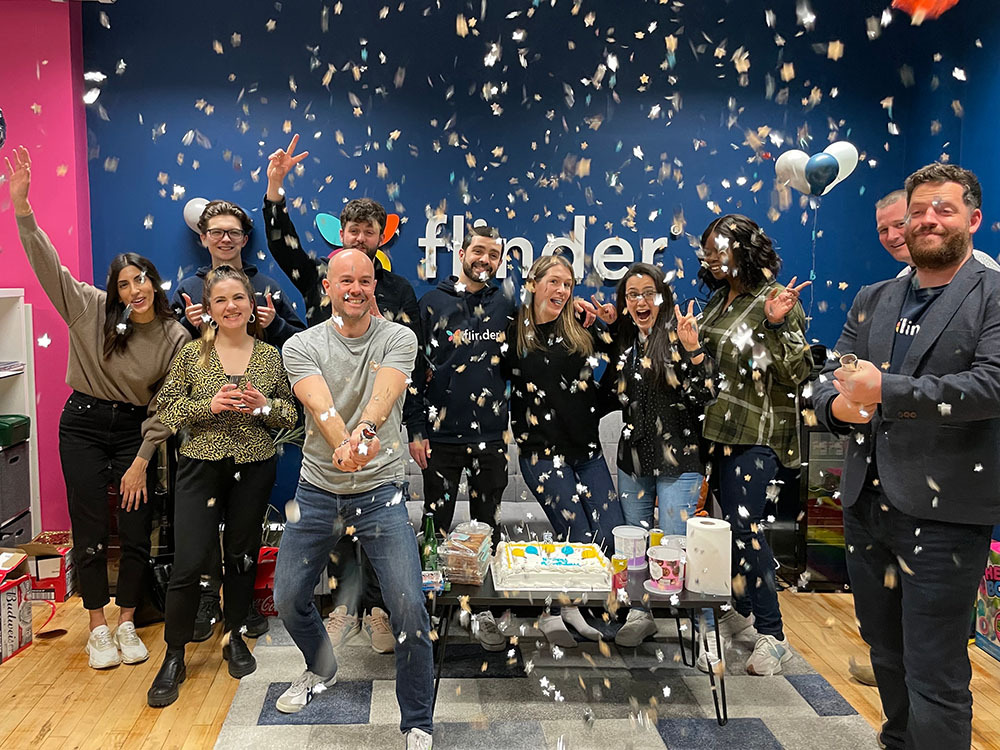 flinder team celebrating in the flinder office